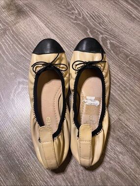 Restricted Beige and Black Cap-Toe Ballet Flats with Bow